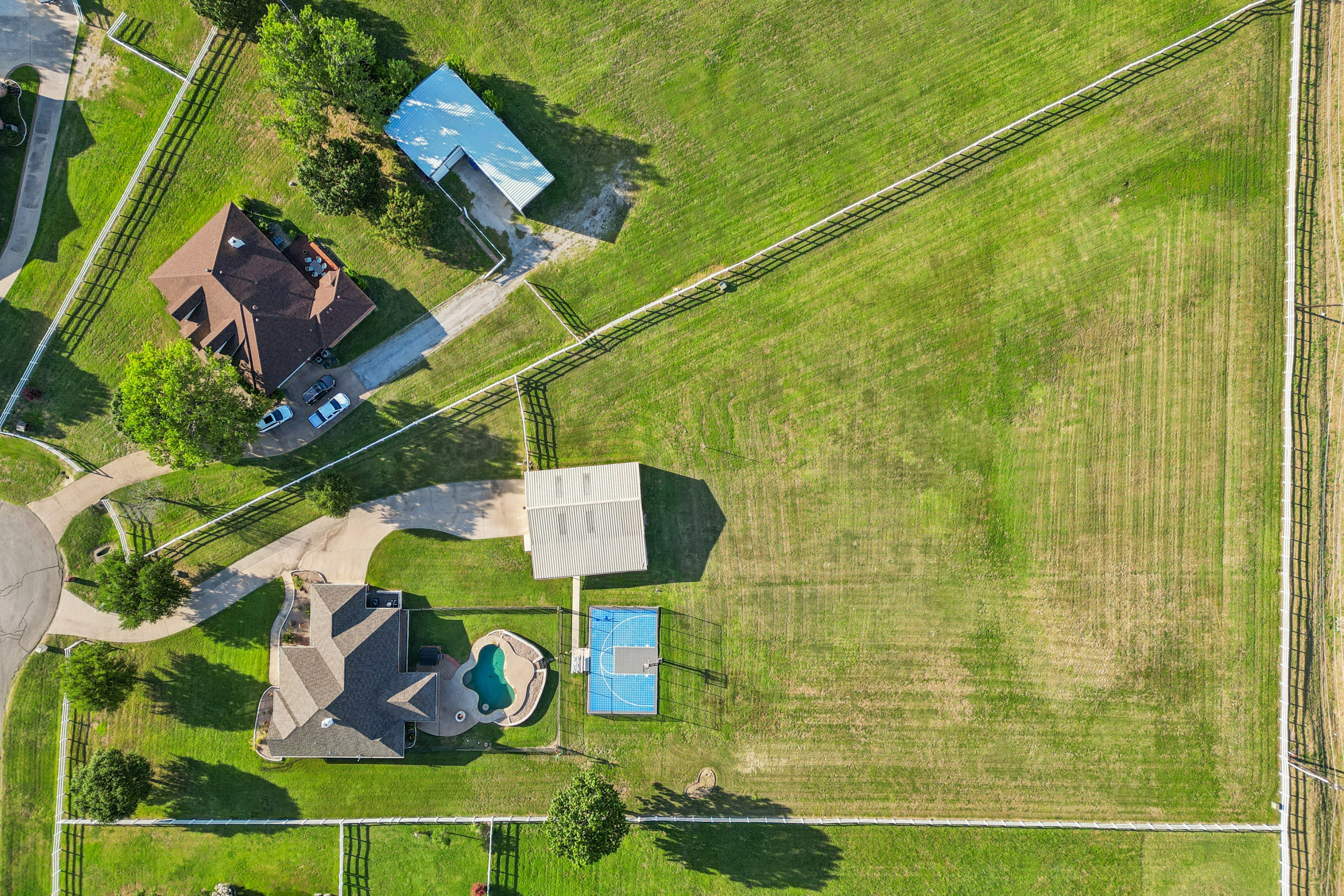 saltwater pool with table at 10332 Round Hill Fort Worth, 30x40 insulated shop with horse stalls